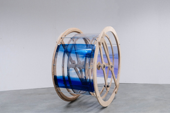 A wooden installation with blue translucent material